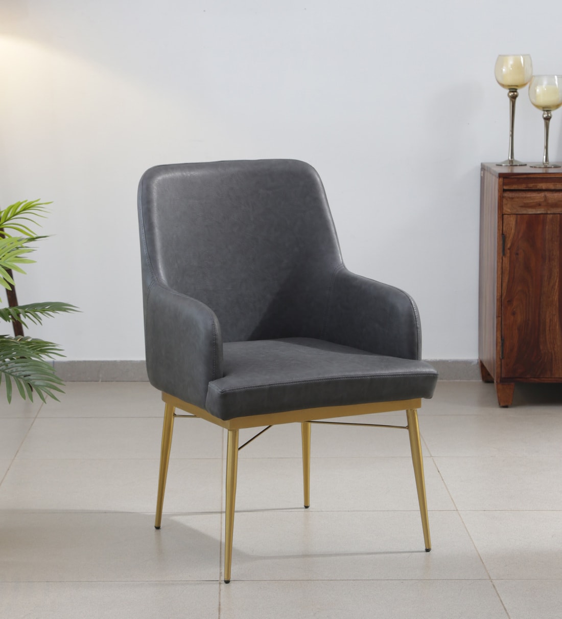 Dalores Leatherette Arm Chair In Brass Finish